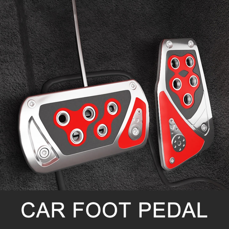 Car foot pedal covers with red and black inserts and silver plates on vehicle floor