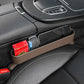 Car seat gap storage organizer, brown tray holding small items beside console