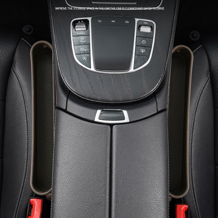 Black car seat crevice storage box pair mounted beneath the center console for essentials