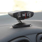 Black LC35 compass ornament mounted on car dashboard with suction cups