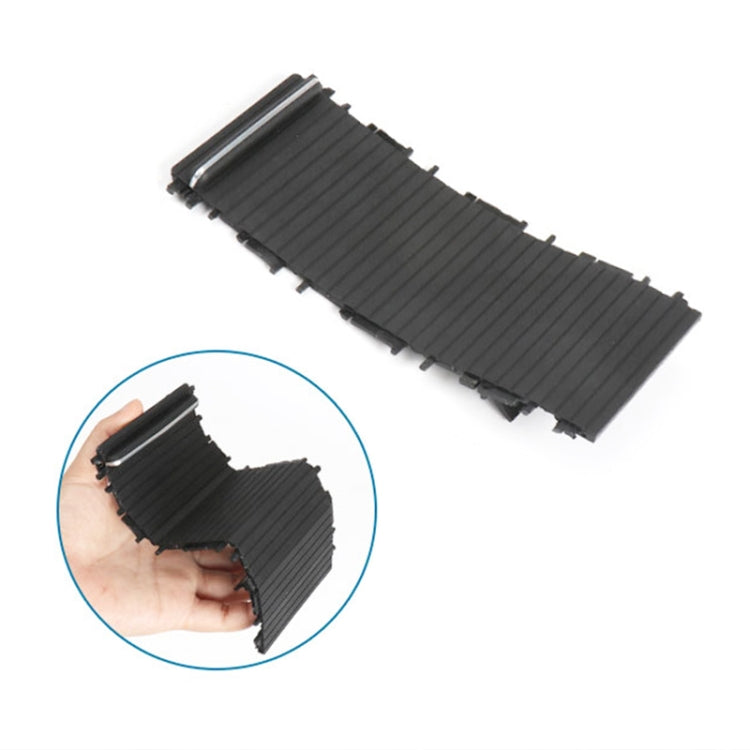 Black ribbed cup holder cover insert shown in hand with tab edges