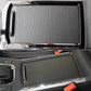 Black ribbed cup holder cover insert installed in dashboard console area
