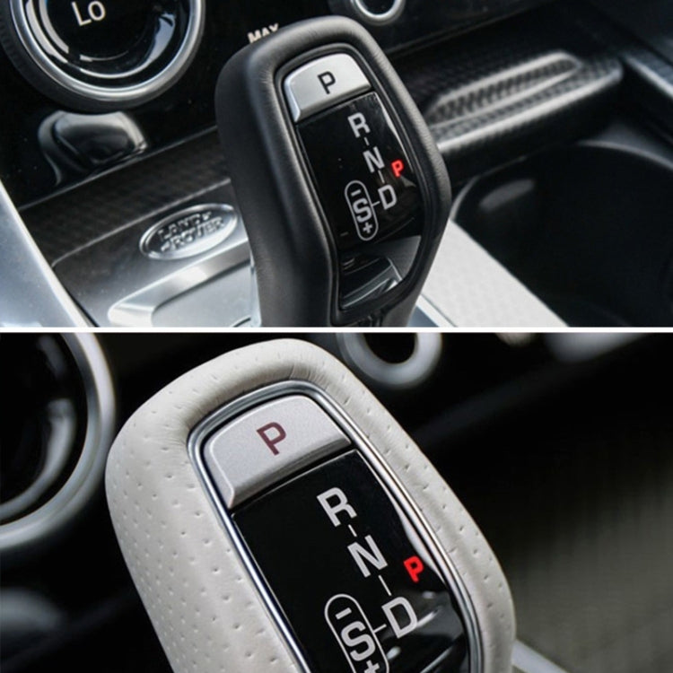 Gear selector with illuminated P shift button on black automatic knob