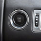 Start/stop engine button installed in dashboard with silver bezel and black center pad