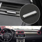 Silver air vent adjustment strip on dashboard vent grille, close-up view.