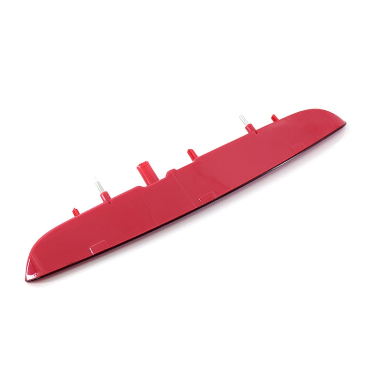 Red high-mount brake light with mounting tabs on the underside