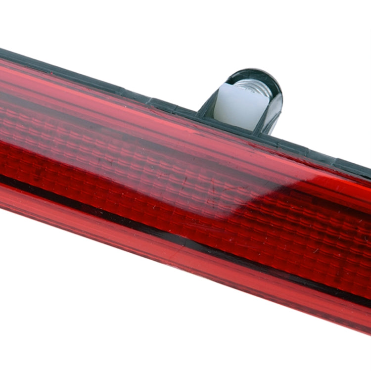 Close-up of red high position brake light lens with ribbed texture