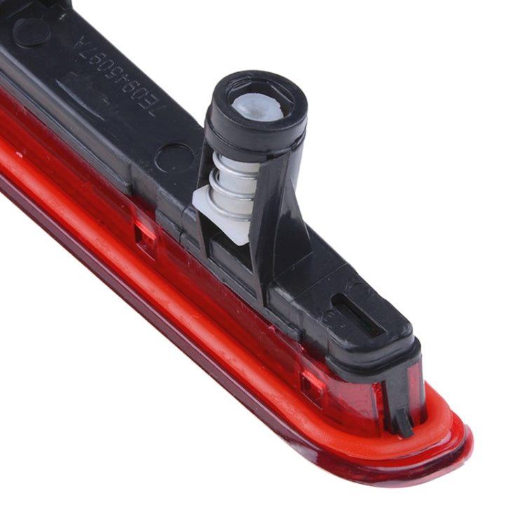 Close-up of black mounting bracket on red high position brake light