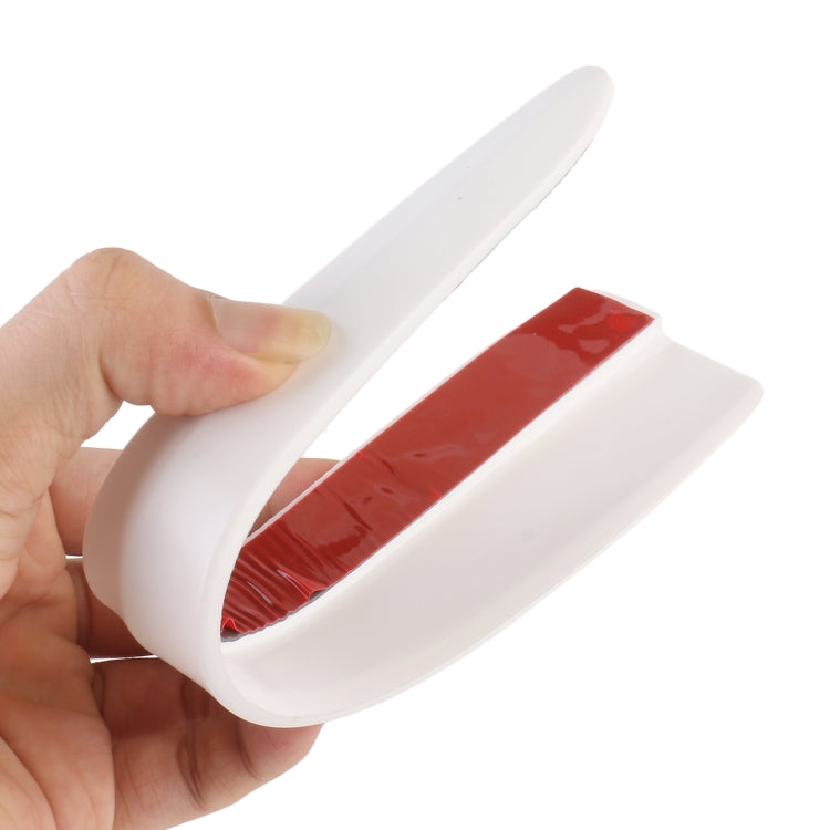 White long silicone bumper strip set (2-pack) held in hand, flexible U shape