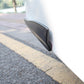 Black long silicone bumper strip installed on car bumper corner edge