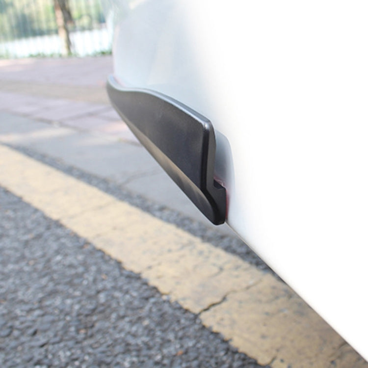 Black long silicone bumper strip installed on car bumper corner edge