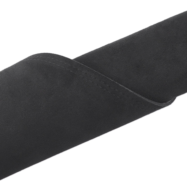 Black dashboard lightproof mat with textured edge seam close-up
