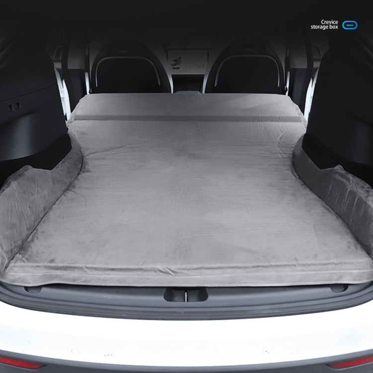Gray suede car mattress fully spread in vehicle cargo area