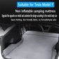 Gray suede non-inflatable camping mattress laid flat in car trunk