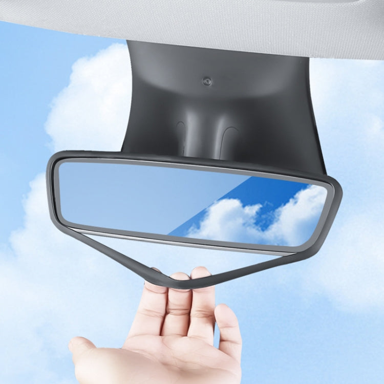 Black silicone rearview mirror protective cover held in hand, rectangular frame