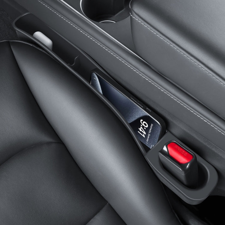 Black car seat gap storage box set along the seat center gap