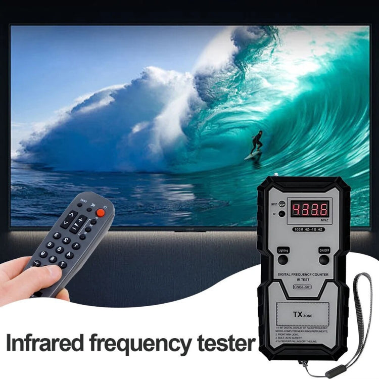 Infrared frequency tester on table, red LCD readout and TX zone area, black housing