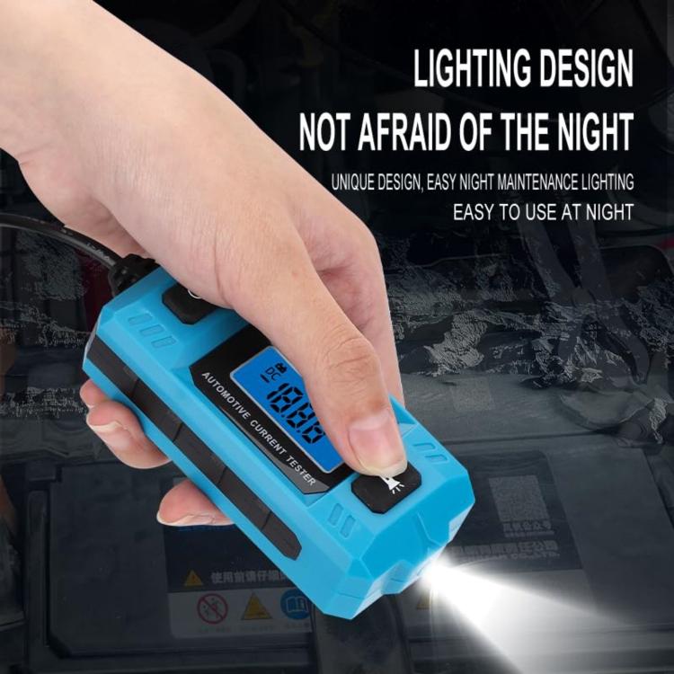 Hand holding blue automotive current tester with LCD screen and blade fuse adapter