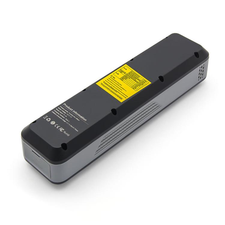 Cordless portable tire inflator underside with yellow warning label and vent openings