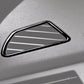 Dashboard air vent frame sticker close-up, black trim with silver slat insert