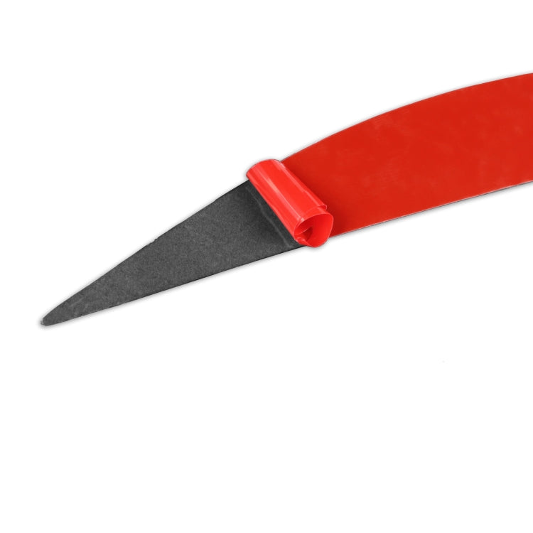 Black headlight eyebrow sticker strip with red applicator clip end.