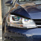 Black headlight eyebrow sticker strip applied along the top edge of a headlamp.