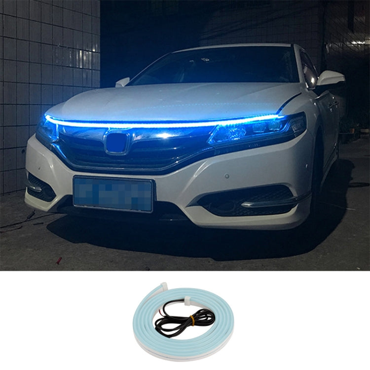 Car LED daytime running light strip kit with bright blue glow across the front headlight bar