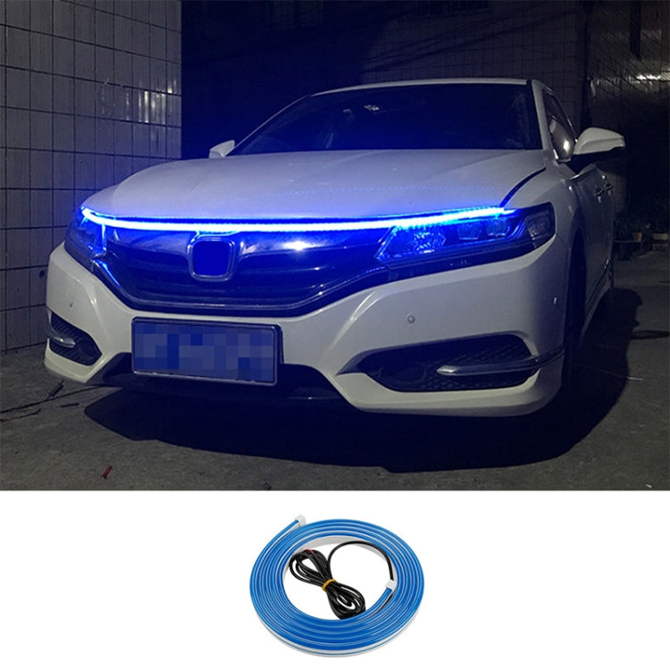 Car LED daytime running light strip kit with strong blue glow across the front headlight bar