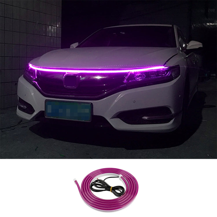 Car LED daytime running light strip kit with purple glow across the front headlight bar