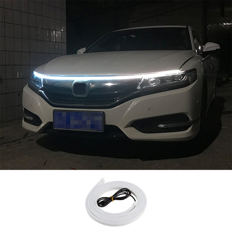 Car LED daytime running light strip kit with blue-white glow across the front headlight bar