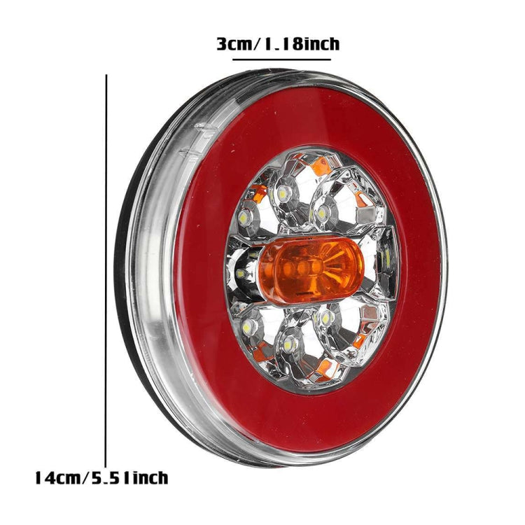 Red oval LED taillight with multi-LED reflector, amber lens, and clear outer rim.