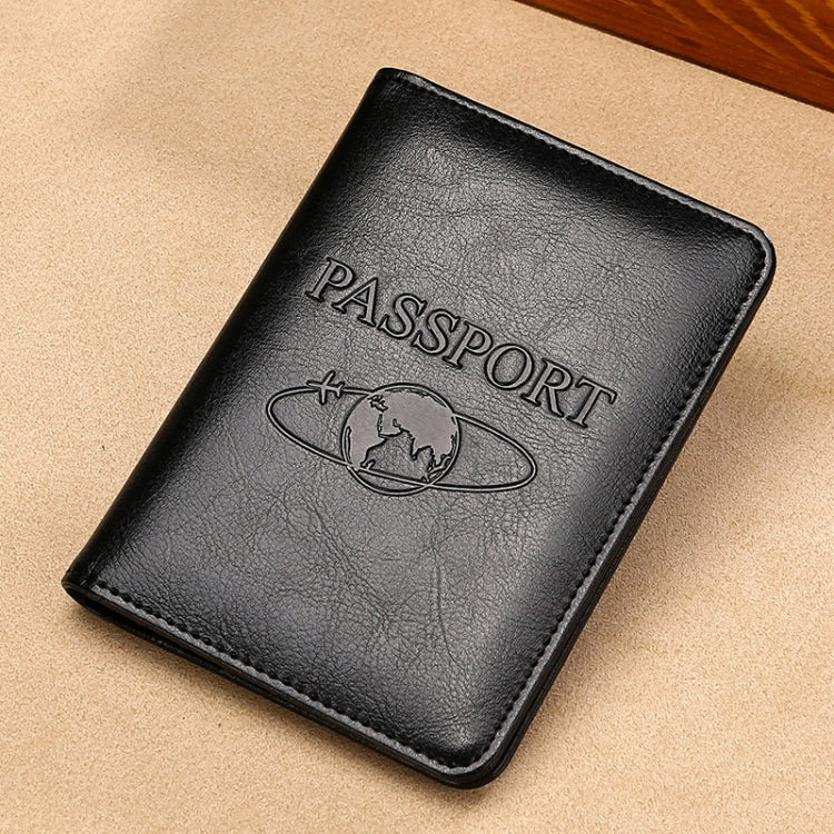 Black RFID leather passport holder, embossed PASSPORT text and globe logo.