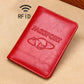 Red RFID leather passport holder with embossed PASSPORT and globe emblem.