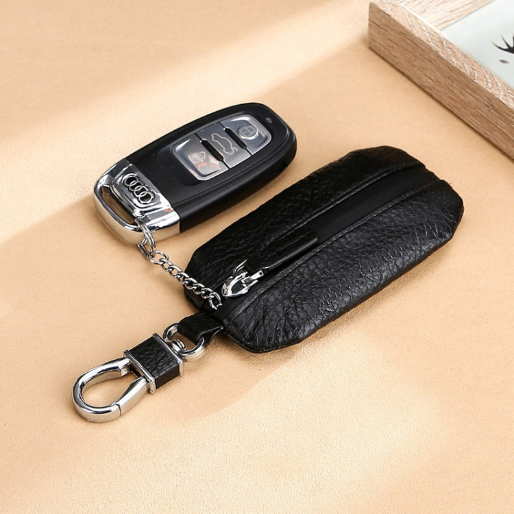 Black litchi-texture key pouch with zipper, metal clasp, and attached keyring chain