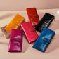 Assorted color leather wallets with zipper closures and front snap straps