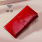 Red leather RFID wallet with zip closure and front snap strap