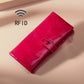Red leather RFID zipper wallet with stitched flap detail and metal zipper pull.