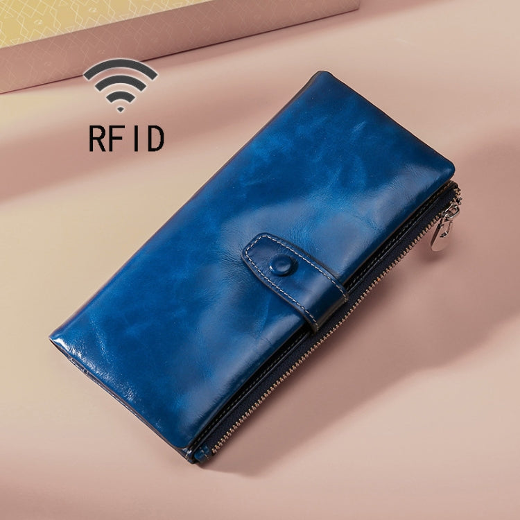 Blue leather RFID zipper wallet with stitched front flap and metal zipper pull.