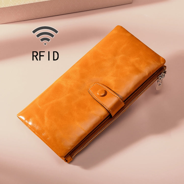 Orange leather RFID zipper wallet with stitched front flap and metal zipper pull.