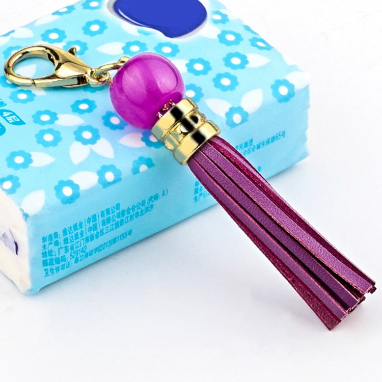 Purple cowhide tassel keychain with round bead and gold carabiner clip