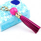 Pink cowhide tassel keychain with round bead and gold carabiner clip