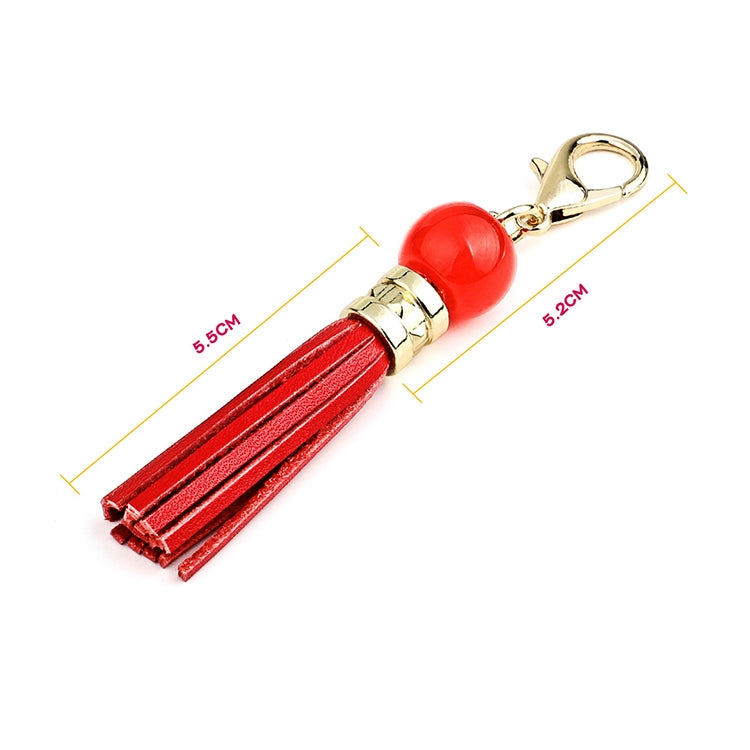 Gold-tone tassel keychain with red bead and red suede tassels, lobster clasp ring