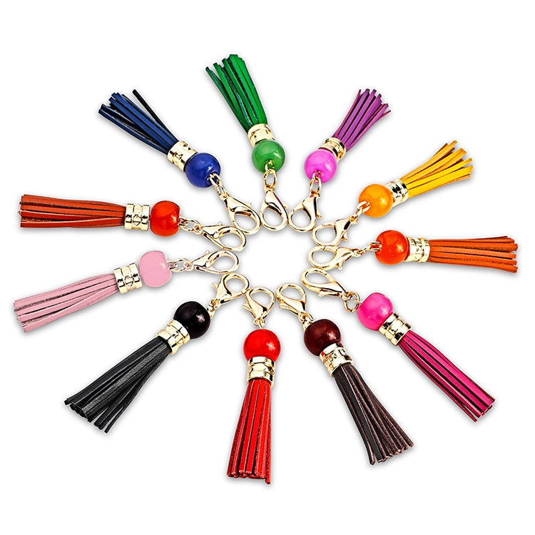 Assorted colorful cowhide tassel keychains with round beads and gold clips