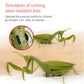 Green praying mantis electric toy with visible underside and black anti-slip tires