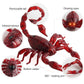 Red scorpion toy with glowing eyes and 360 rotating arm