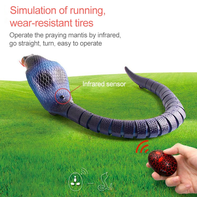 Blue cobra toy crawling on grass with infrared remote egg controller