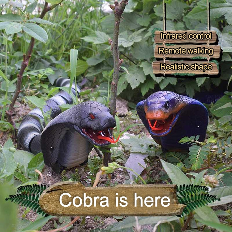 Blue cobra toy standing in foliage with realistic snake shape and open mouth