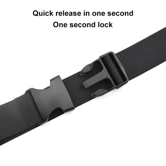 Quick-release buckle on black nylon shoulder strap with adjustment holes