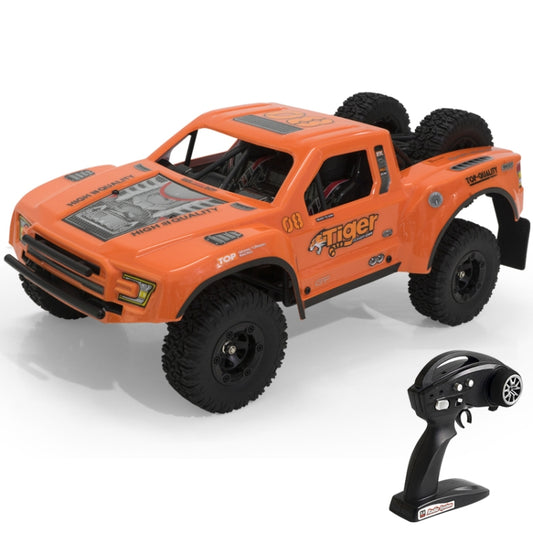 Orange RC off-road short truck with four-wheel drive, large tread tires and cabin detail