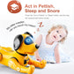 Yellow remote robot dog toy beside a sleeping child
